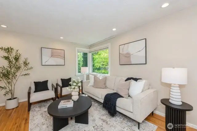 Bright light filled living room with plenty of seating