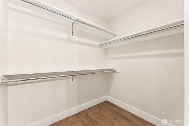 Expansive Primary walk-in closet.