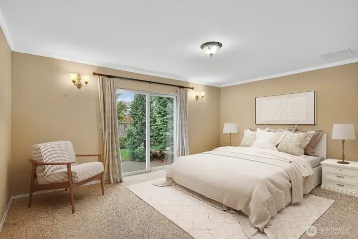 Main level primary bedroom with attached bath and closet plus own slider out to backyard