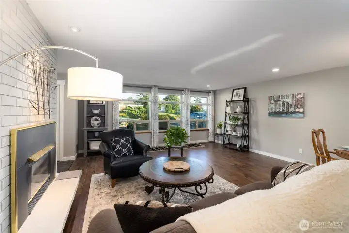 Spacious living area, with a view of the professionally landscaped yard.