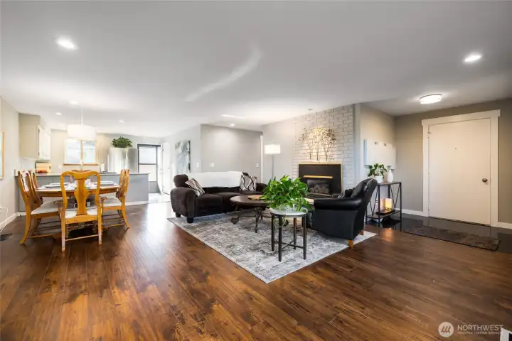 Dining and living area, with entry on the right, kitchen at the back.