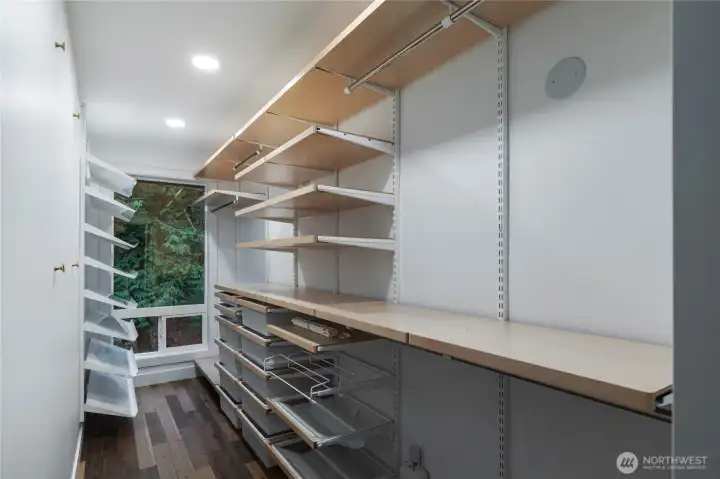 1 of 2 primary walkin closets.