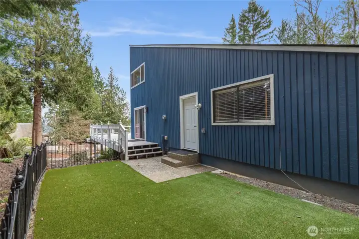 Fully fenced dog run area that connects to wrap around deck.