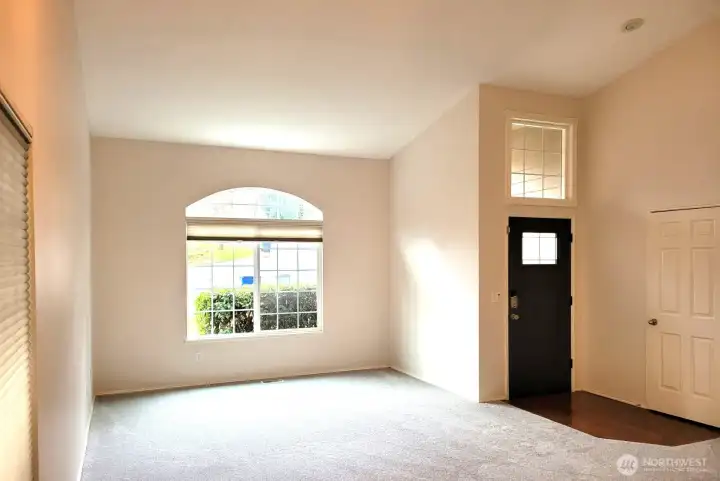 Large, Bright Living Room with Vaulted Ceilings, Fresh Paint and Carpet