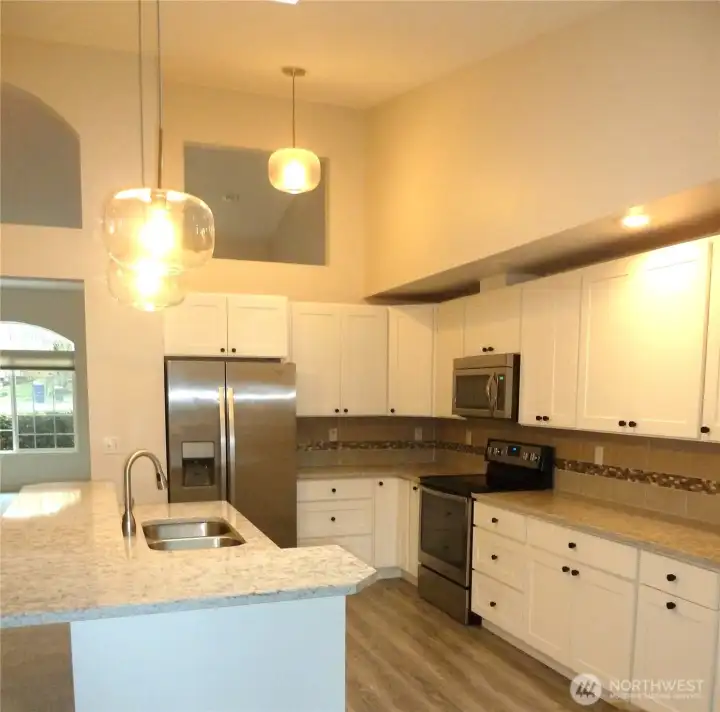 Good Sized Kitchen is Accessible From Both Sides and Is Open to Living, Dining, and Family Rooms