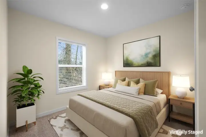 Virtually staged secondary bedroom - two additional bedrooms are positioned in the center of the home with a shared bathroom