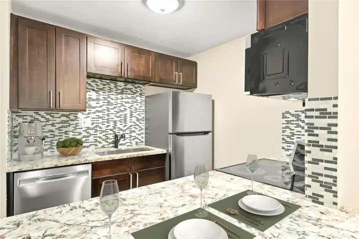 Updated kitchen with convenient pass-through to dining room.