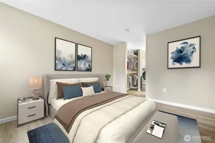 Primary bedroom with walk-in closet that includes washer/dryer and access to the full bathroom.
