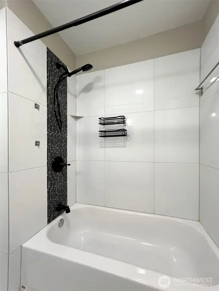 Updated full bathroom with tub and shower.