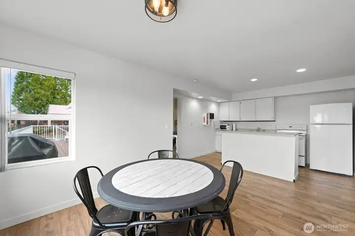 Casual dining area and kitchen in updated clubhouse.