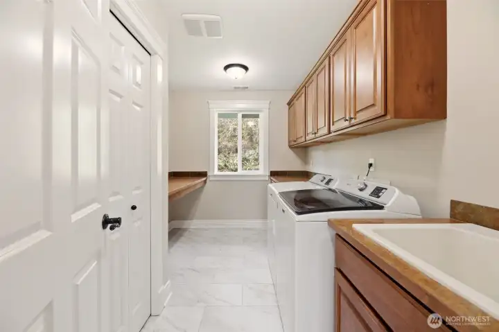 Upper level Generously sized Utility room with Storage space