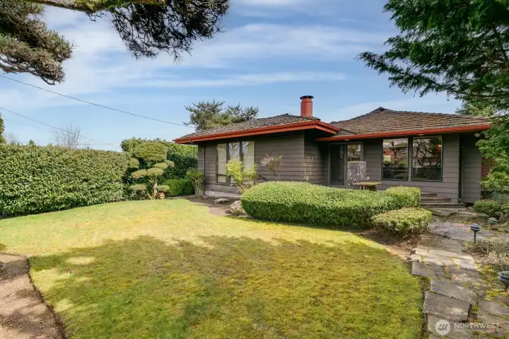 Ample backyard area and deck off of dining room.