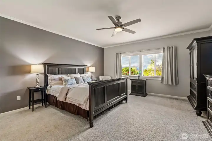 Primary bedroom with morning sunrise view.