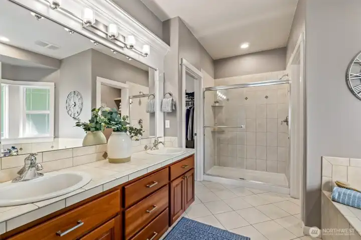 Primary bath with separate water closet to the right and walk in closet to the left.