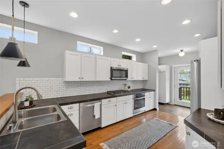 Classic kitchen has been modernized with stainless steel appliances.