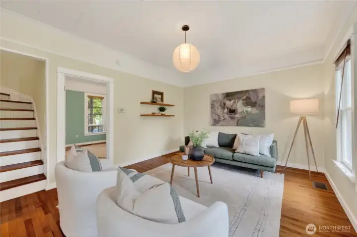 Bedroom is off the living room.  Stairs lead upstairs.