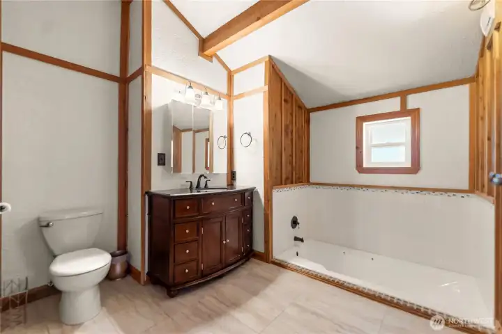 Main floor bathroom with sunken tub
