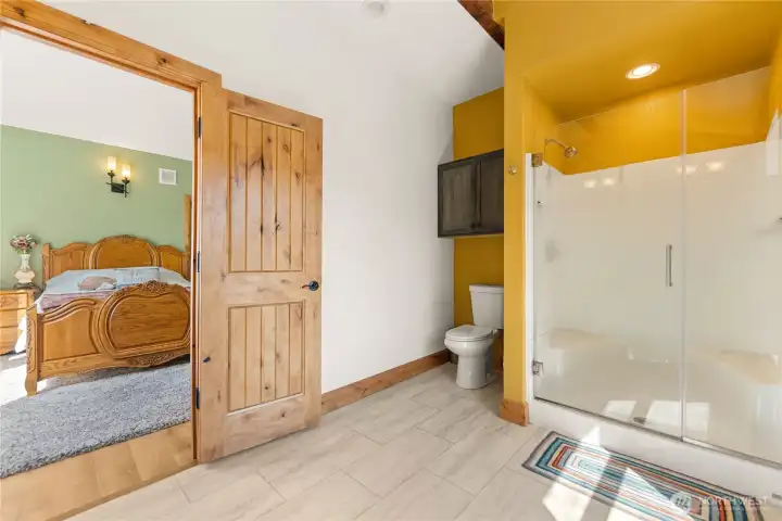 Primary bathroom looking back toward bedroom