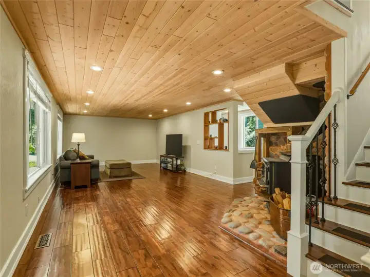 view of the family room featuring solid maple floors and Pine tung and groove ceilings
