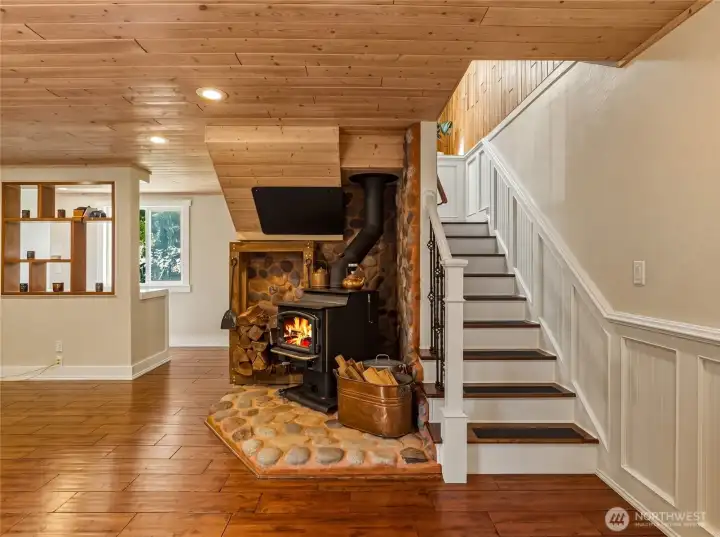 the wood stove is centrally located to help heat the home
