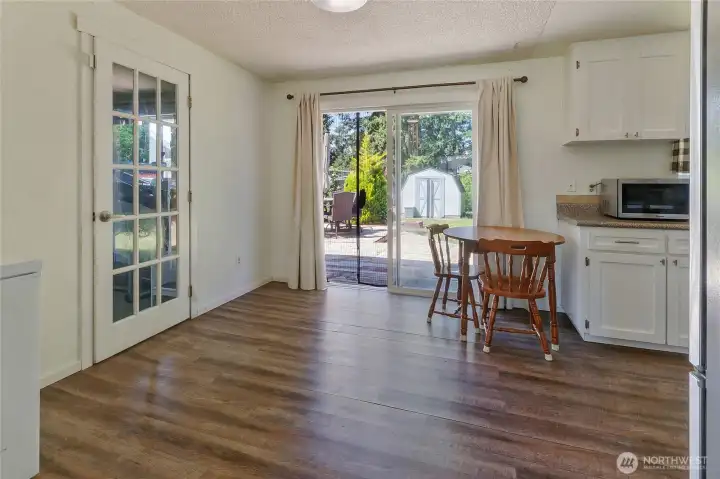 Eat in kitchen area looking out slider to large full size deck and big yard