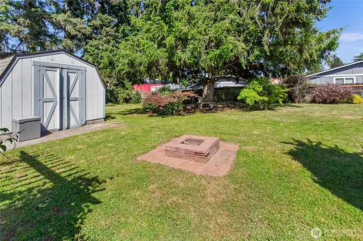 Back yard with over sized shed for storage