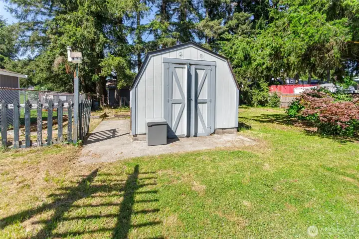 Shed with gardening area next to it