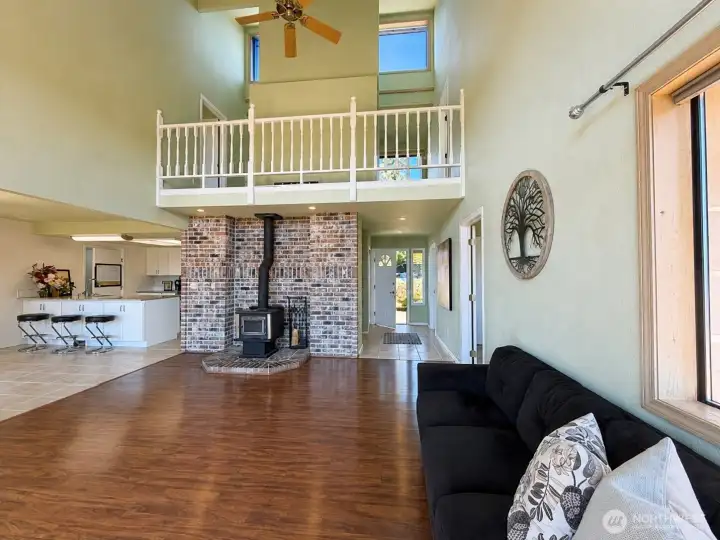 Living room has 2 story ceilings, a wood stove, opens to the deck and is bathed in light all day long. Living room has 2 story ceilings, a wood stove, opens to the deck and is bathed in light all day long.