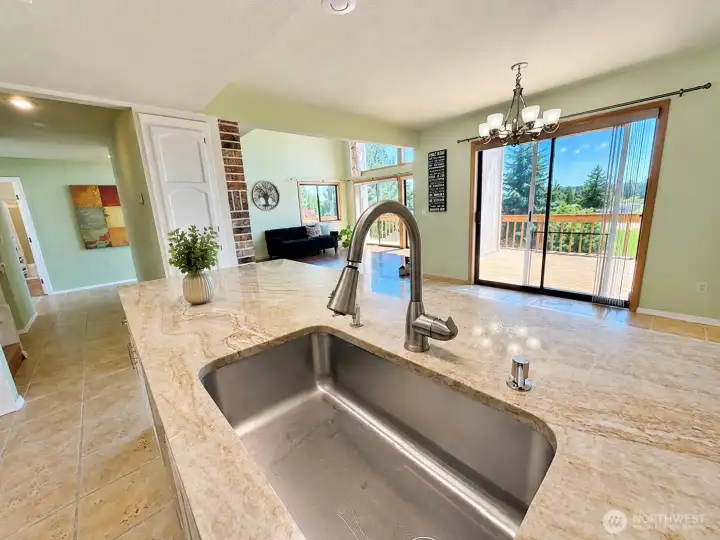 Your island has a view of the living and is attached to the dining spaces, great for entertaining. Your island has a view of the living and is attached to the dining spaces, great for entertaining.