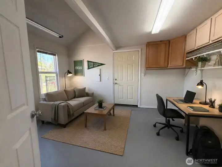 Living area in room with lofted bedroom. Living area in room with lofted bedroom.