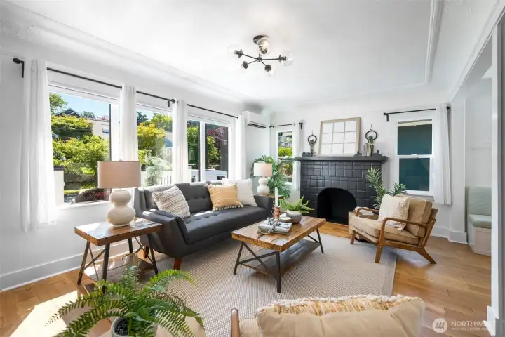 A wood burning fireplace, double pane windows, and warmth, wide engineered hardwood floors on this level. Also there is a mini-split that keeps the first floor nice and cool.