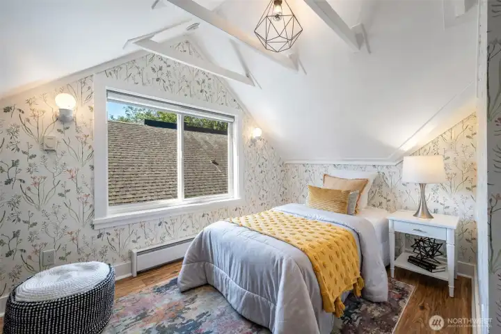 The absolutely charming kids room, very sweet. So many cool nooks and crannies in this room, it would also make a great office space.