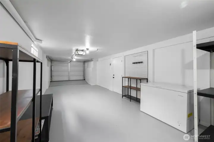 The long 2-car tandem garage and lots of room for the storage or gear for hobbies. The box-freezer can also stay.