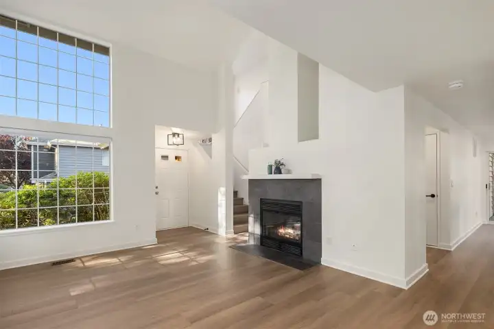 Spacious living room with soaring ceiling.