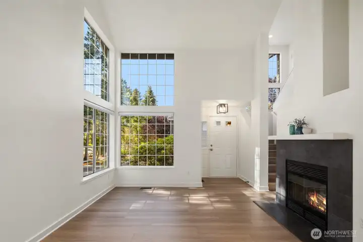 Cozy fireplace anchors the room.
