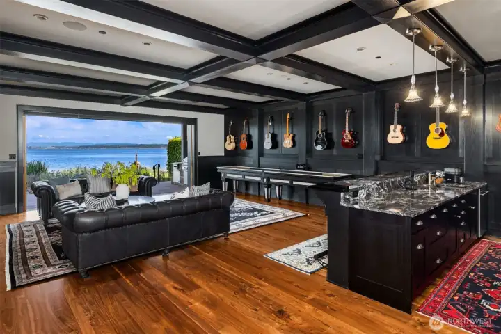 The ultimate hang out room...The lighting throughout this house is noteworthy. The nano doors slide open to let all that greatness in! A full bar, perfect for movie night. The ultimate hang out room...The lighting throughout this house is noteworthy. The nano doors slide open to let all that greatness in! A full bar, perfect for movie night.