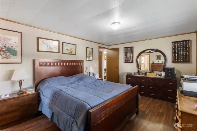 Spacious primary suite with walk-in closet and private bathroom.
