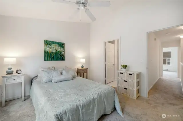 Spacious primary bedroom with freshly cleaned carpets and the entire condo was just painted inside. Door on the right is the attached bathroom.