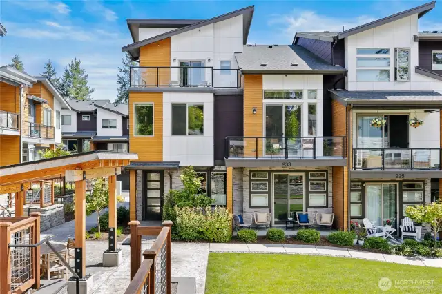 Tucked in off the street resides the quiet townhome that lives like a single family home