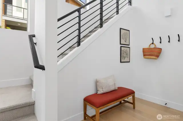 Nook just off door to garage, room to have a boot bench and hang up your coats