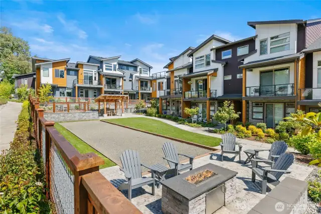 Lawn area, Bocce ball court, BBQ and dining area along with a firepit for evening gatherings