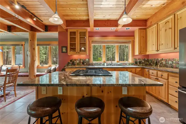 Guests will overflow into this kitchen by choice!