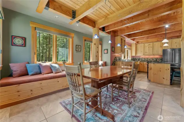 Bay window seats add social connection to dining room
