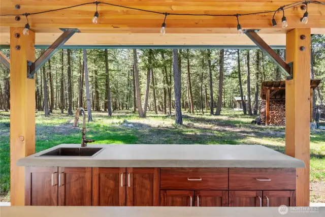 Outdoor kitchen includes water, power & fridge!
