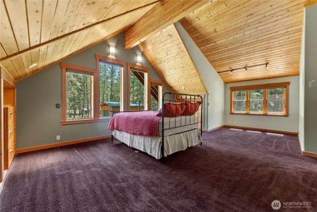 Primary bedroom designed for a large cabinet behind bed