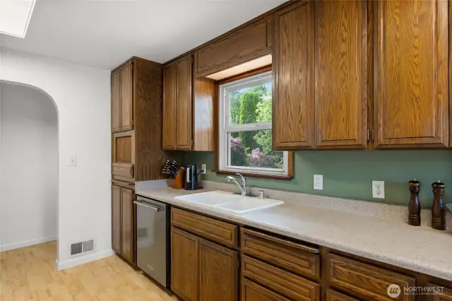 Window over sink to enjoy the beauty of the backyard.