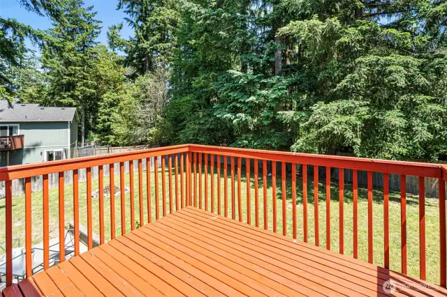 The open living area flows to the deck, perfect for grilling