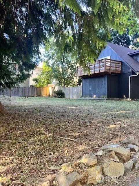 Another view of side yard to house