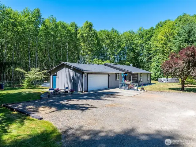 Welcome home! This beautifully maintained single-story home offers privacy and charm, nestled in a lush natural setting with a large driveway, attached 2-car garage, detached 1-car garage and inviting front patio.
