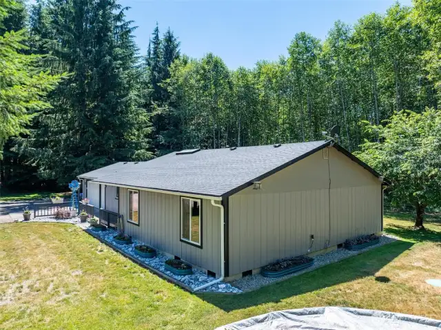 This single-level home is nestled on 7.16 secluded acres across two separate parcels, surrounded by mature trees and Pacific Northwest beauty. With a newer roof, vinyl windows, and thoughtful landscaping features like gravel-lined drainage and decorative edging, the exterior is both low-maintenance and functional. The home offers privacy, natural light, and tranquil views from every angle—perfect for those seeking space, quiet, and connection to nature.